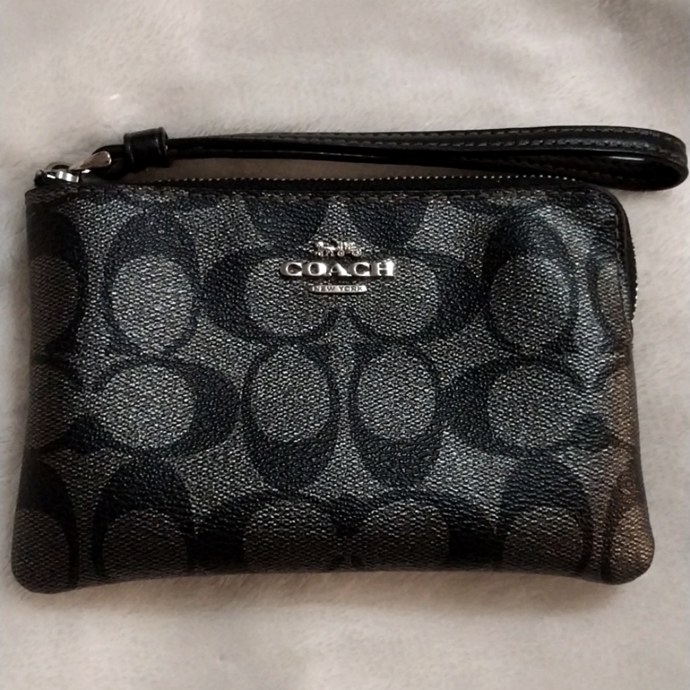 Black wristlet Coach bag